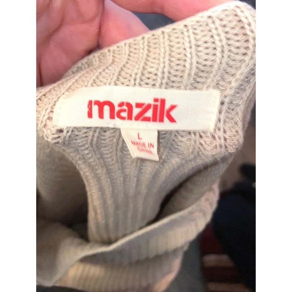 Mazik textured knit sweater features a soft beige/ivory color and a relaxed fit